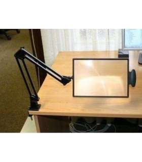 Table-top magnifier mounted on the tabletop